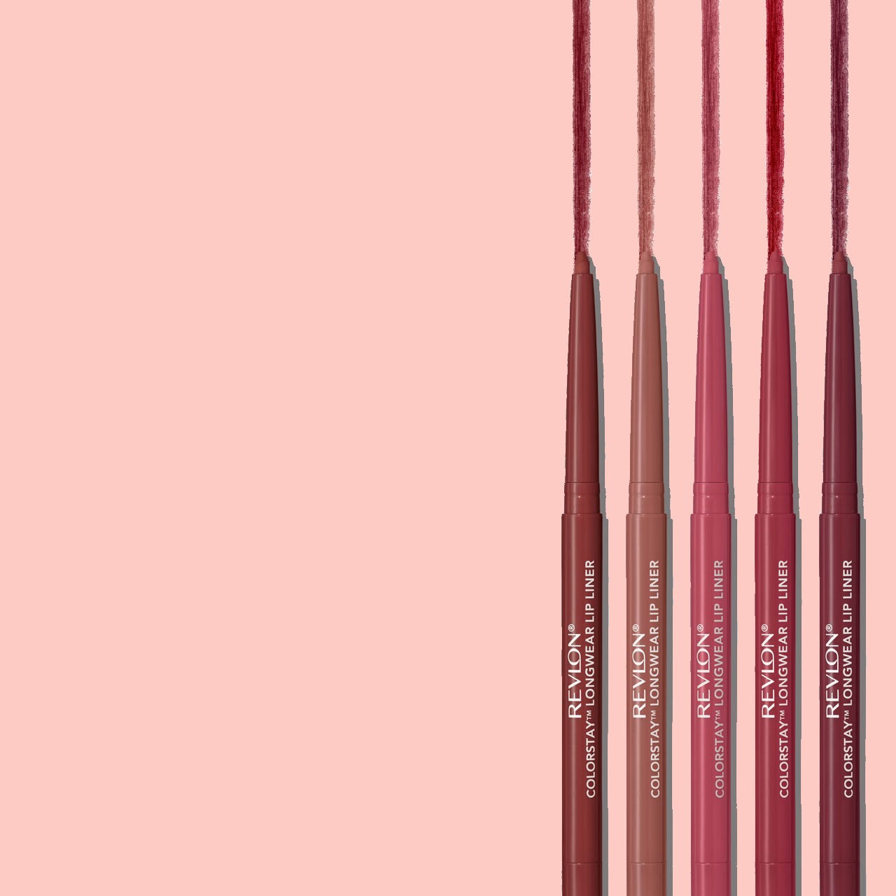 Revlon colorstay lip liner pencils on a pink background